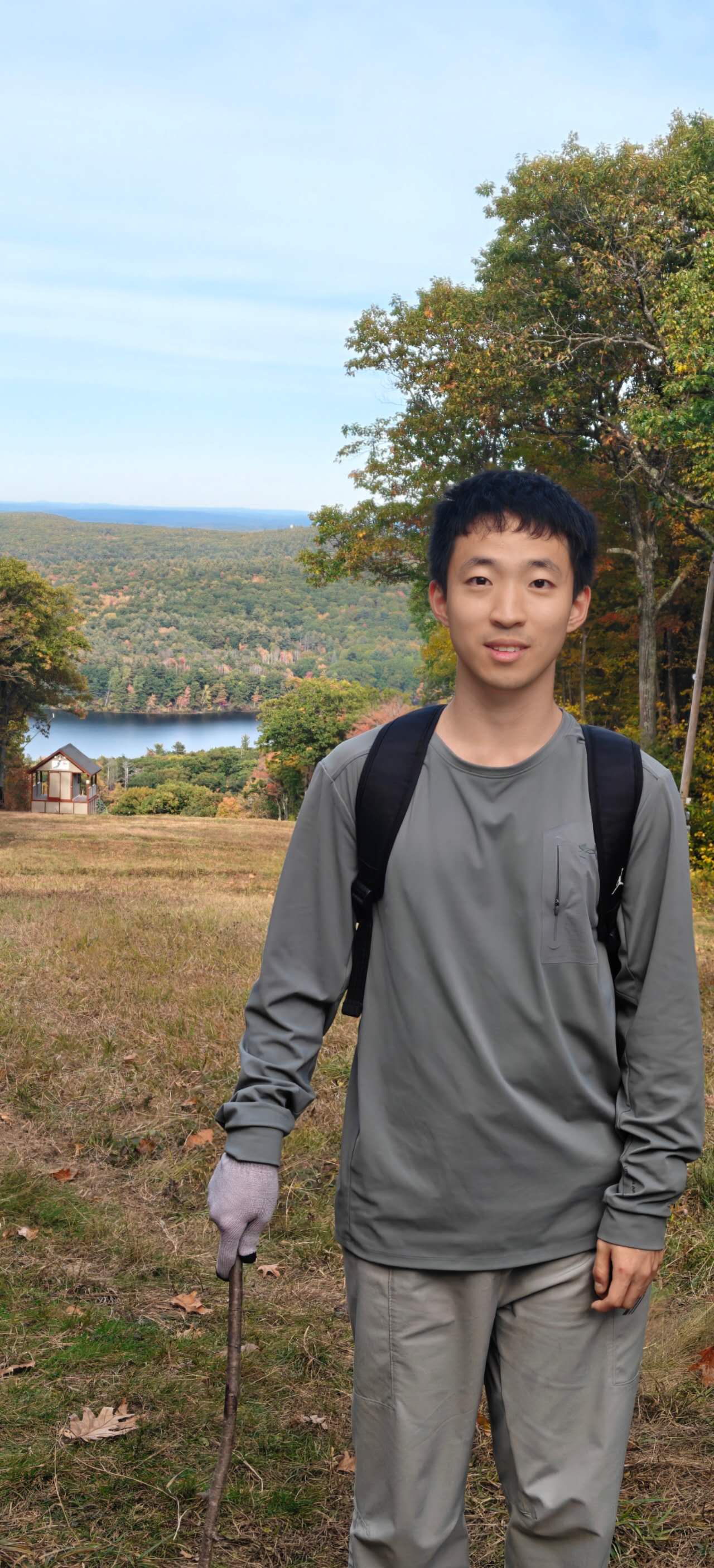 Benlu Wang outdoors in an autumn landscape